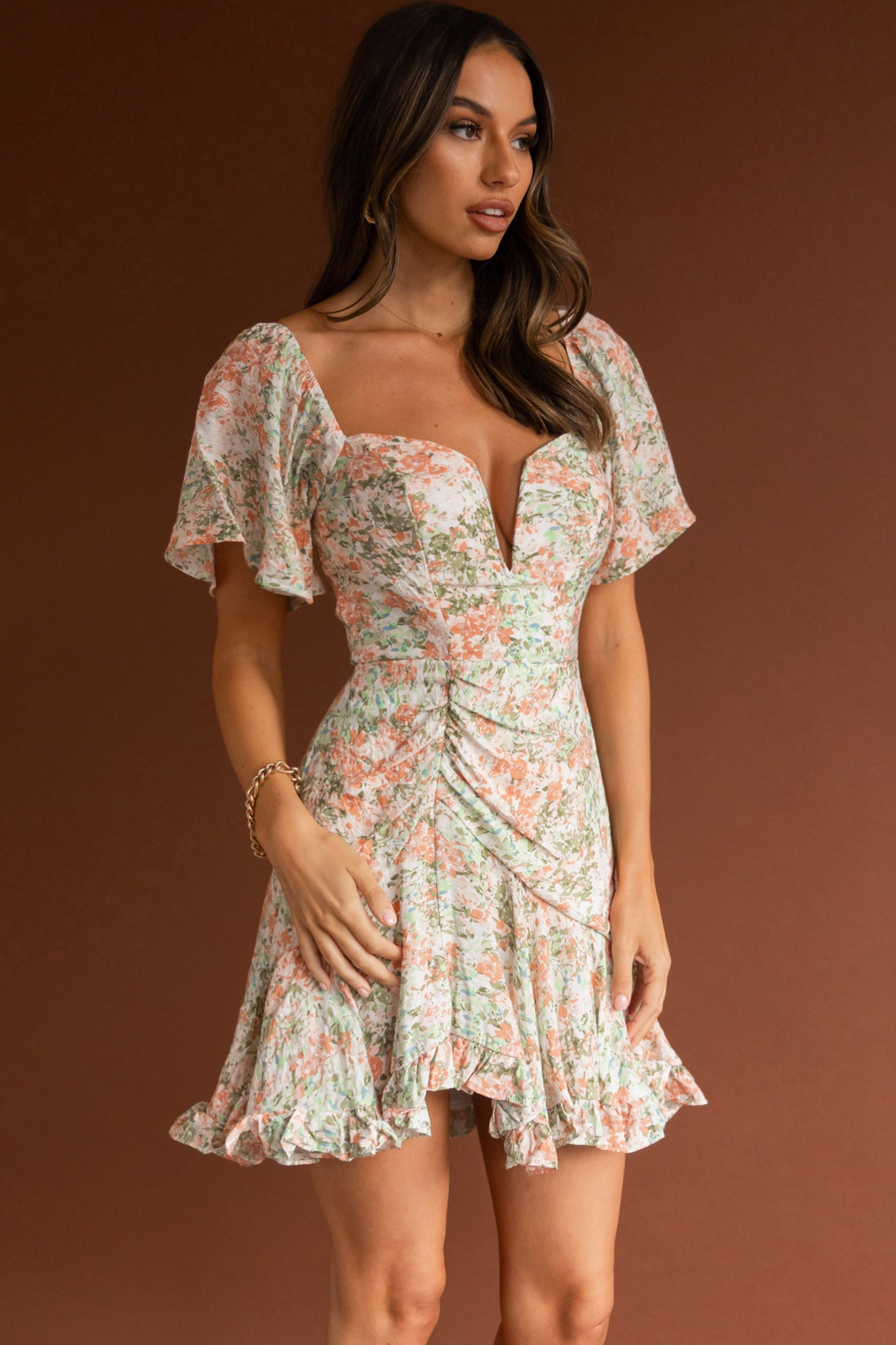 Shop the Leona V-Bust Frill Mini Dress Floral Peach | Selfie Leslie